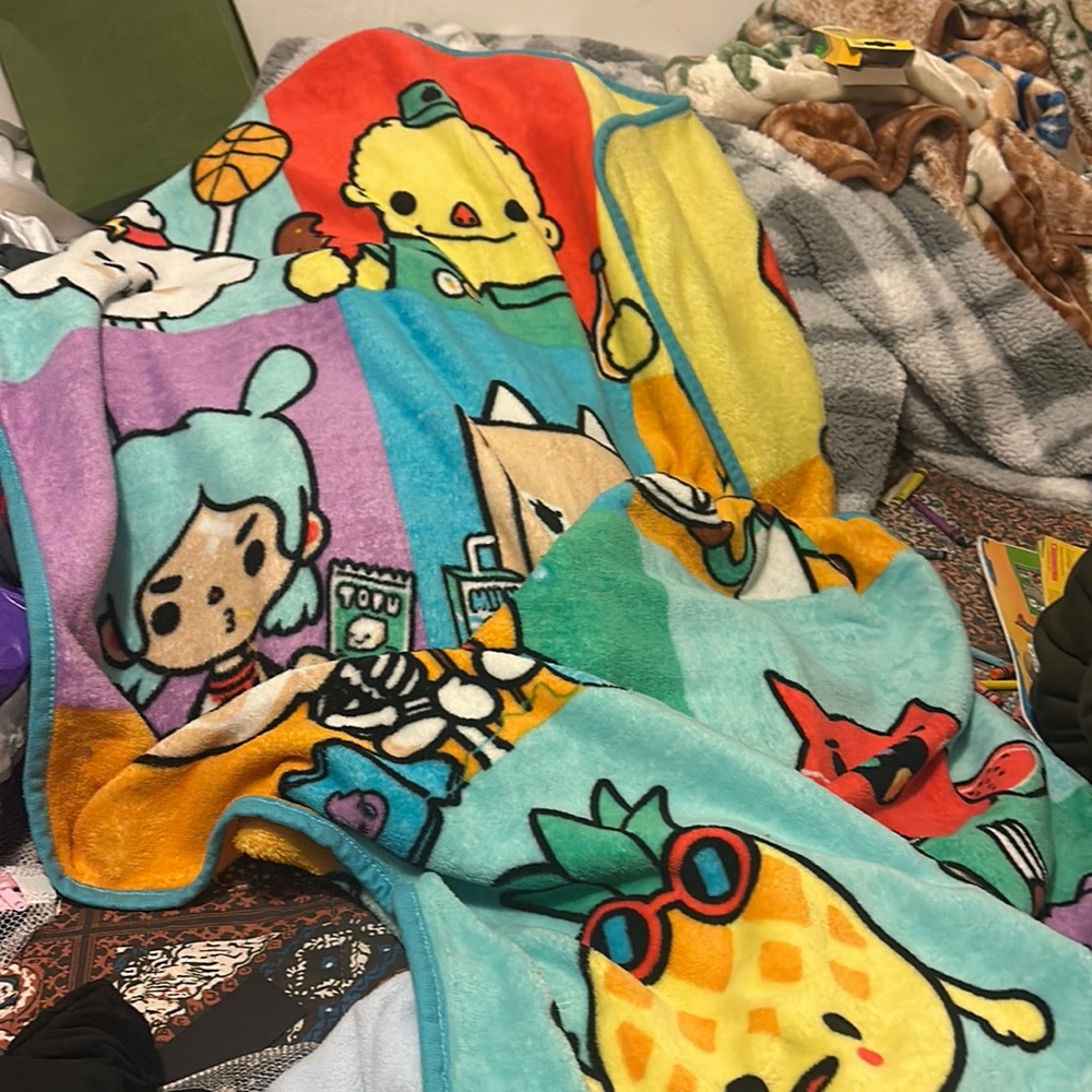 2 blankets for baby, a hat, blue sweater, 2 sleeping bags